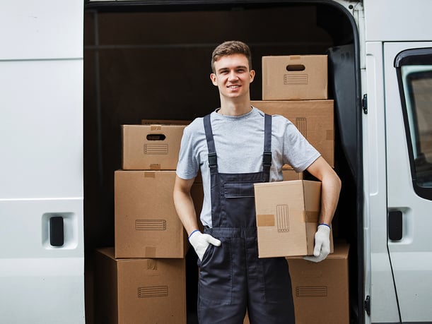 a-young-handsome-smiling-worker-wearing-uniform-is-LYTXM5J